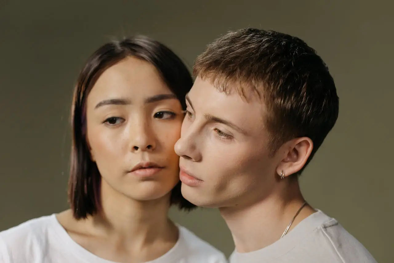 Close-up portrait of a thoughtful couple with an intimate connection.