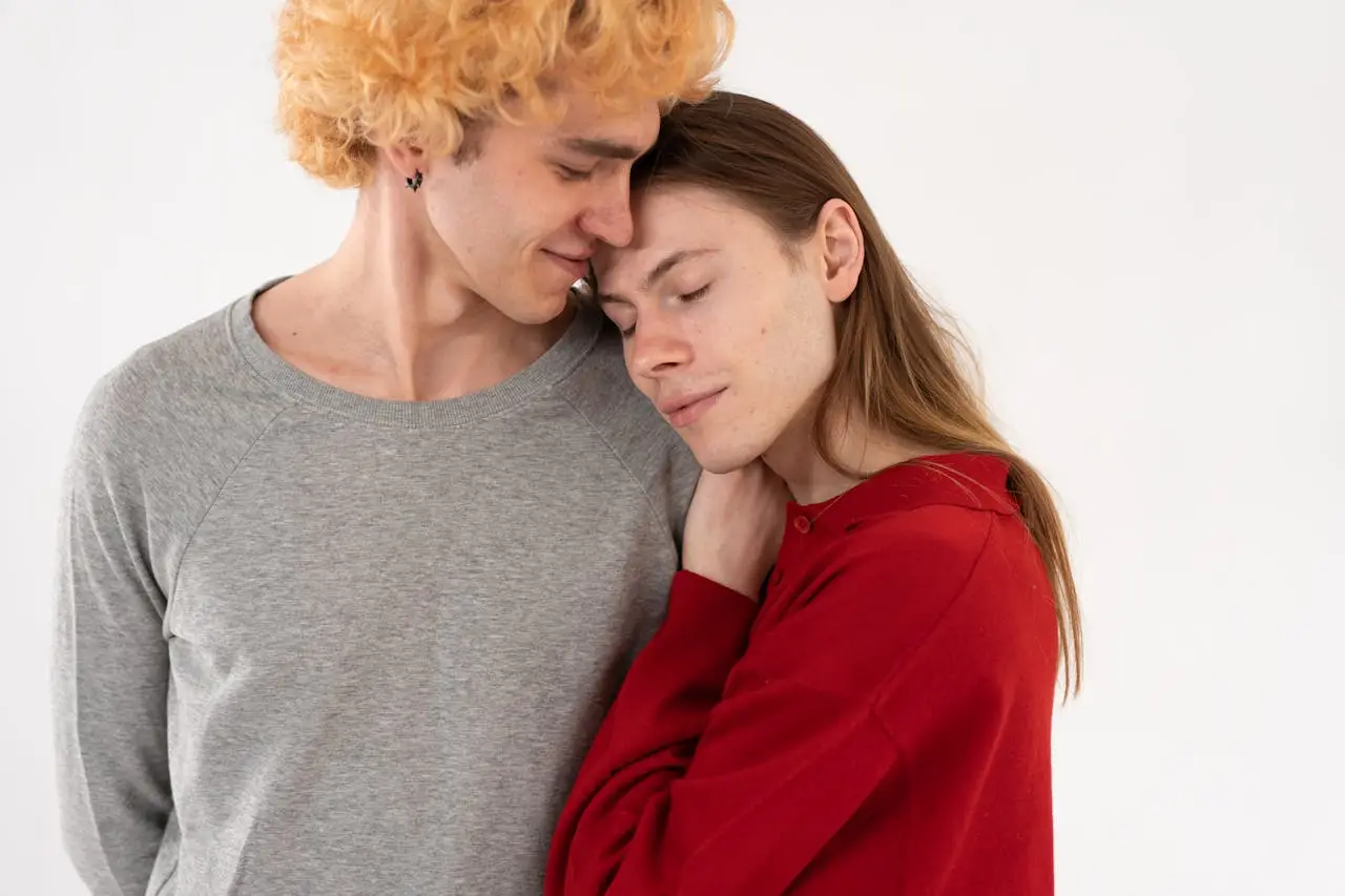 A warm and affectionate embrace between a young couple expressing love and togetherness.
