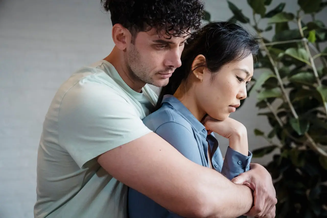 A close-up of a loving couple embracing, symbolizing intimacy and connection.